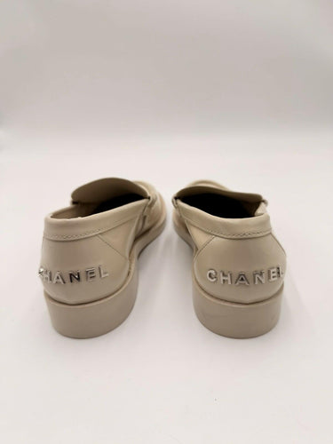Women’s Chanel Shiny Calfskin Logo Loafers in beige Size 35