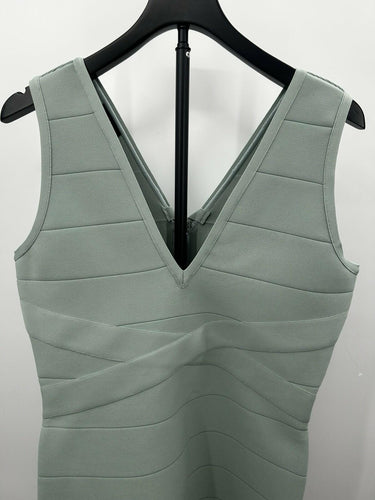 Bebe Woman’s mint green V-neck bandage mini dress Crisscross Waist Size L